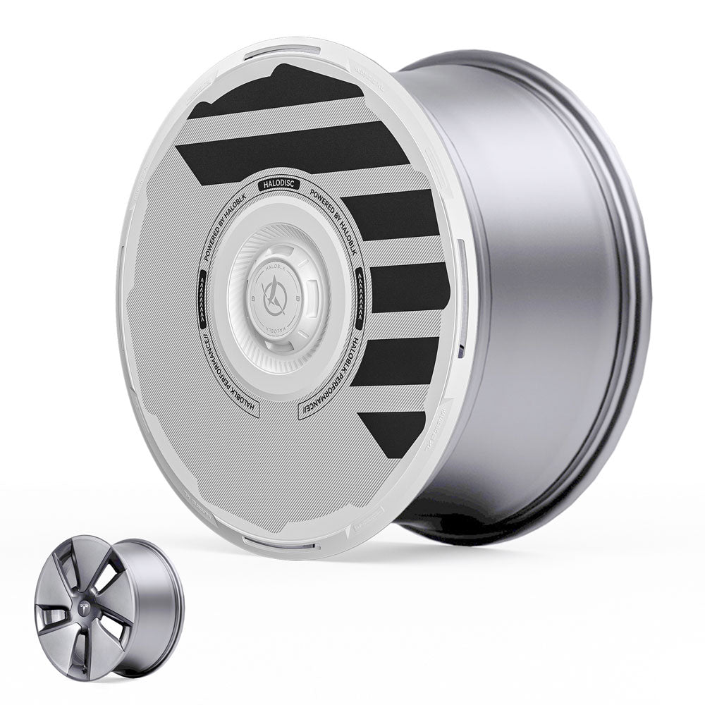 The HALODISC 2 Wheel Covers by HALOBLK Store for Tesla Model 3 (2017-2023) 18" Aero Wheels feature a large, futuristic silver design shown beside a smaller, traditional five-spoke alloy wheel.