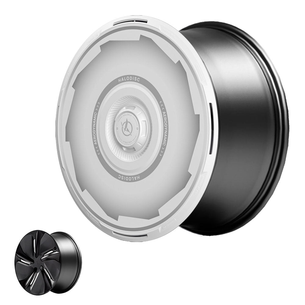 A black glossy Tesla Model Y Juniper 19" Crossflow wheel from HALOBLK Store is displayed with two HALODISC 2 Vision-GT wheel covers: one large, semi-transparent with text, and a smaller, darker disc alongside.