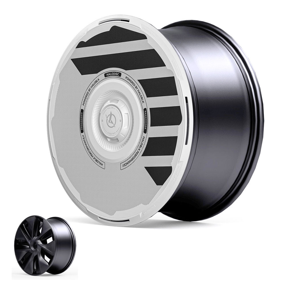 The HALODISC 2 Wheel Covers for Tesla Model Y 19" Gemini Wheels by HALOBLK Store feature a black and silver aerodynamic design with bold black stripes. A small inset compares it to a traditional black spoked rim.