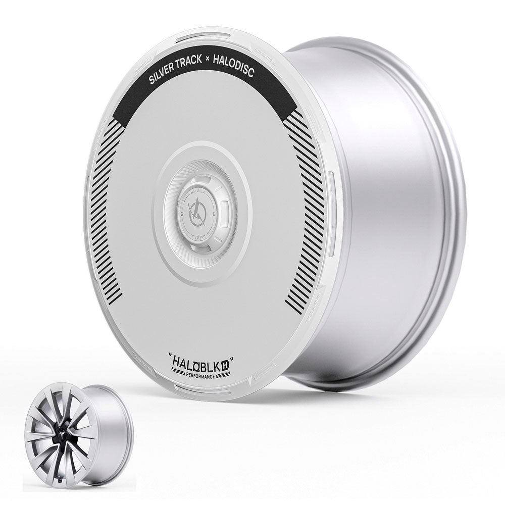 The HALODISC 2 Wheel Covers for Tesla Model 3 2019-2023 19" Sport Wheels by HALOBLK Store feature a sleek, silver, disc-shaped rim labeled SILVER TRACK x HALODISC and include a decorative fan-shaped cover.