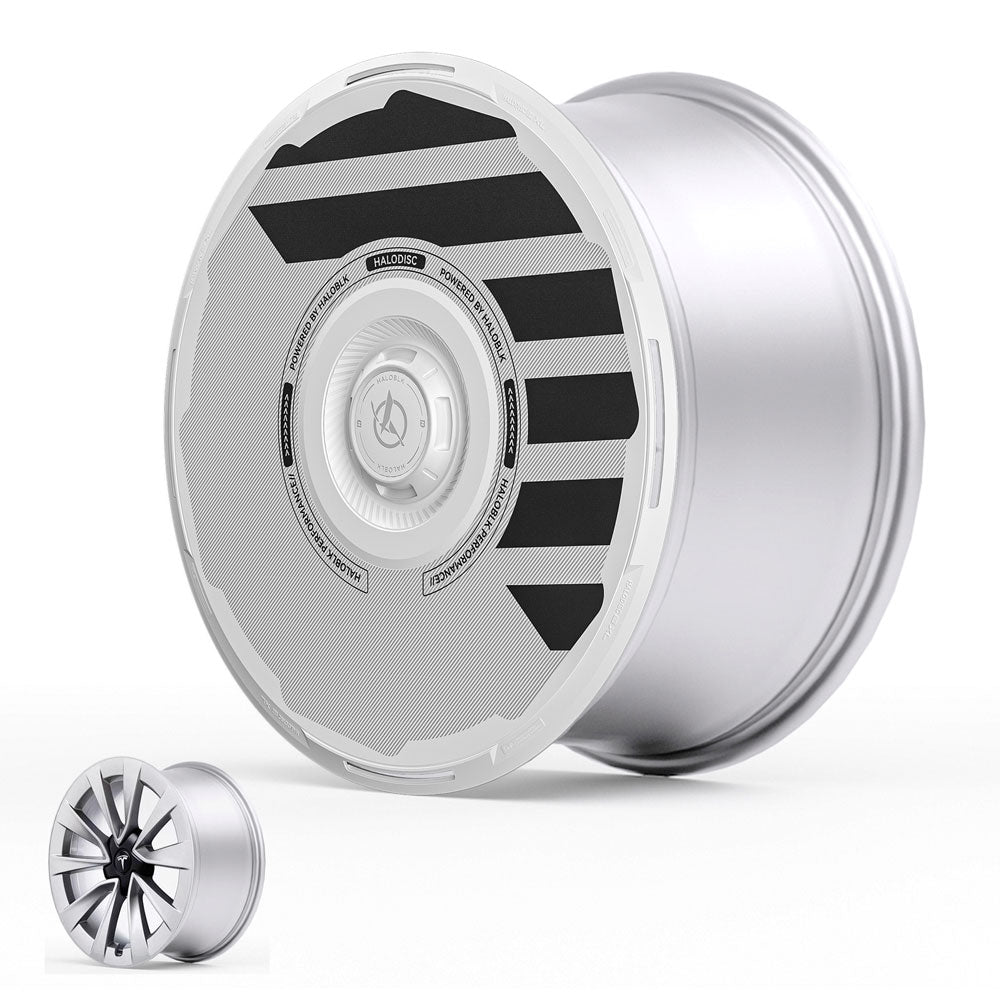 The HALODISC 2 Wheel Covers by HALOBLK Store for Tesla Model 3 (2019-2023) feature a unique flat, partially covered silver face with black geometric stripes, shown alongside a traditional multi-spoke wheel for comparison.