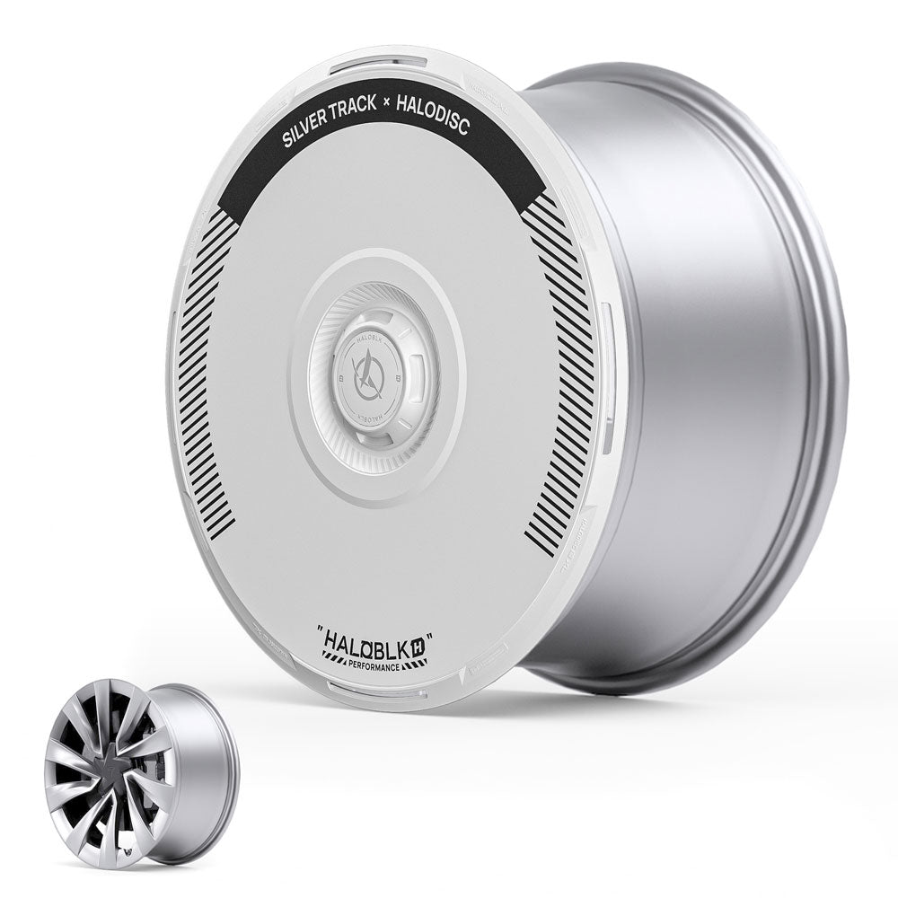 A large, flat, silver HALODISC 2 Wheel Cover by HALOBLK for Tesla Model Y Juniper 20" Helix 2.0 Wheels (Silver Track) is shown next to a smaller, standard spoke alloy wheel for comparison.