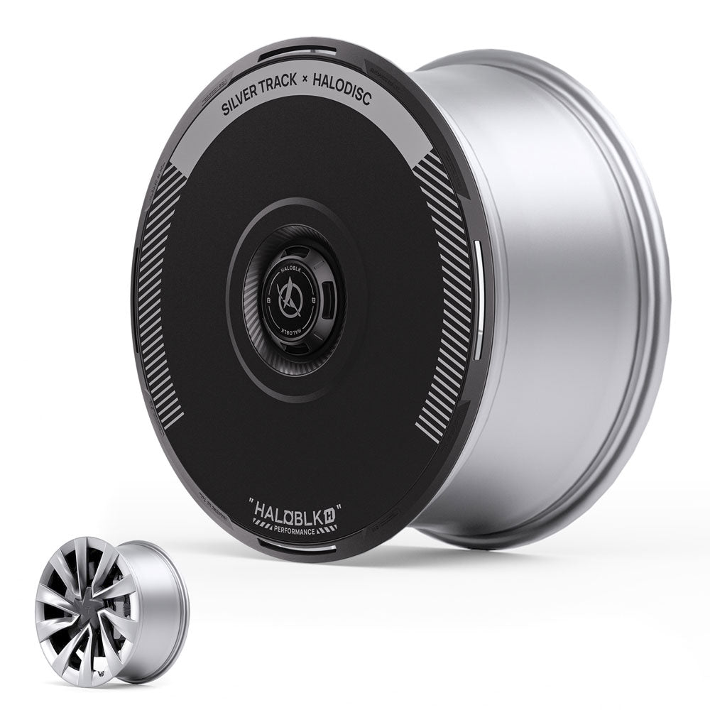 A large silver HALODISC 2 wheel cover for Tesla Model Y Juniper 20" Helix 2.0 Wheels, labeled SILVER TRACK from HALOBLK Store, is shown with a sleek black center. In front, a smaller multi-spoke rim is displayed.