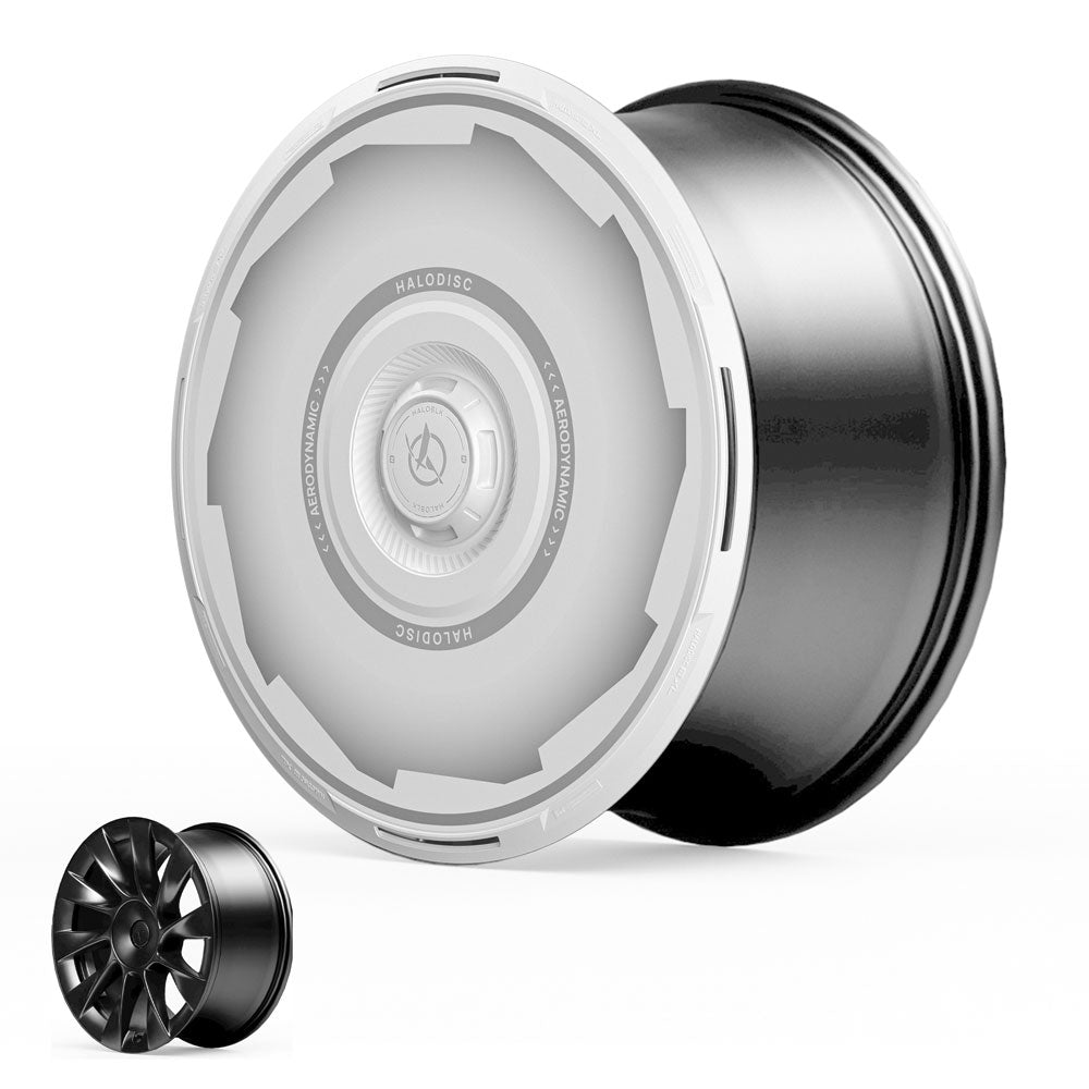 A large, futuristic black and white HALODISC 2 Wheel Cover for Tesla Model Y 20" Induction Wheels by HALOBLK Store sits beside a smaller, traditional black spoked rim, both displayed on a white background.