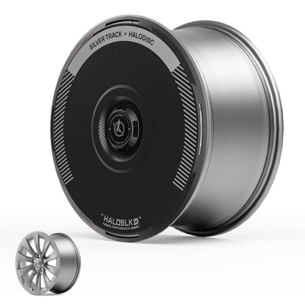 The HALODISC 2 Wheel Covers for Tesla Model S 19" Slipstream Wheels in Silver Track by HALOBLK Store feature a large, metallic rim with a smooth black cover labeled SILVER TRACK x HALODISC; a traditional spoked rim is shown for comparison.
