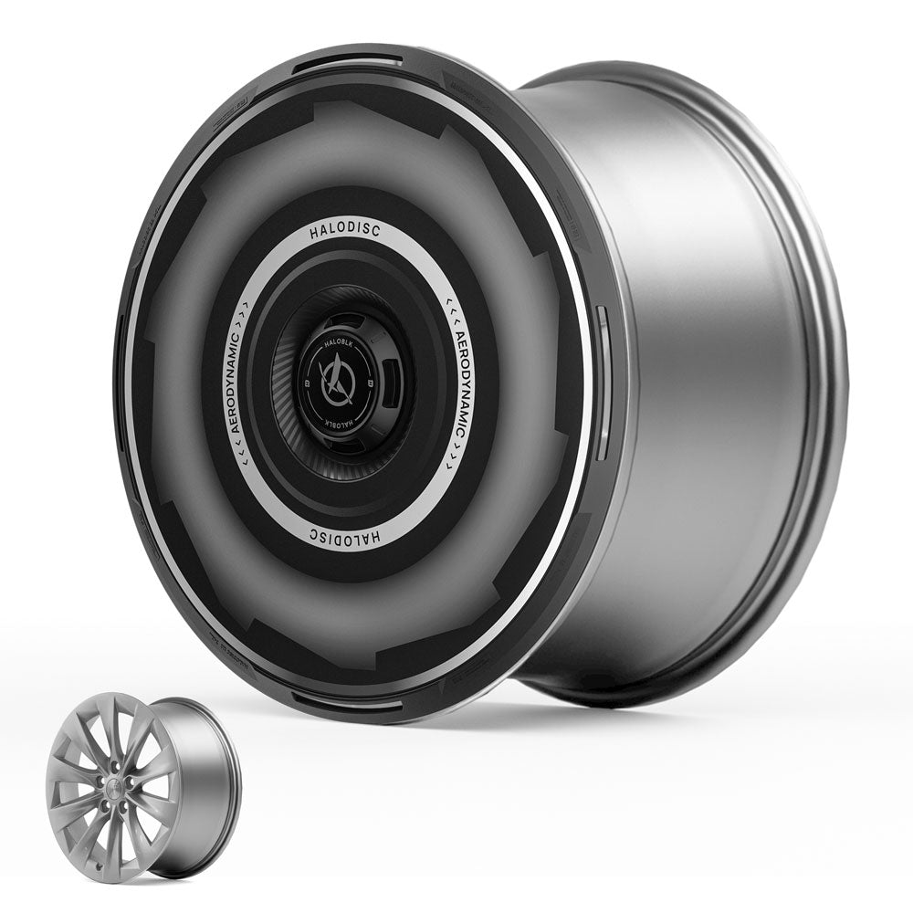 The HALODISC 2 Wheel Covers for Tesla Model S 19" Slipstream Wheels (Vision-GT) by HALOBLK Store are shown upright with a smaller traditional multi-spoke wheel for comparison, both set against a white background.