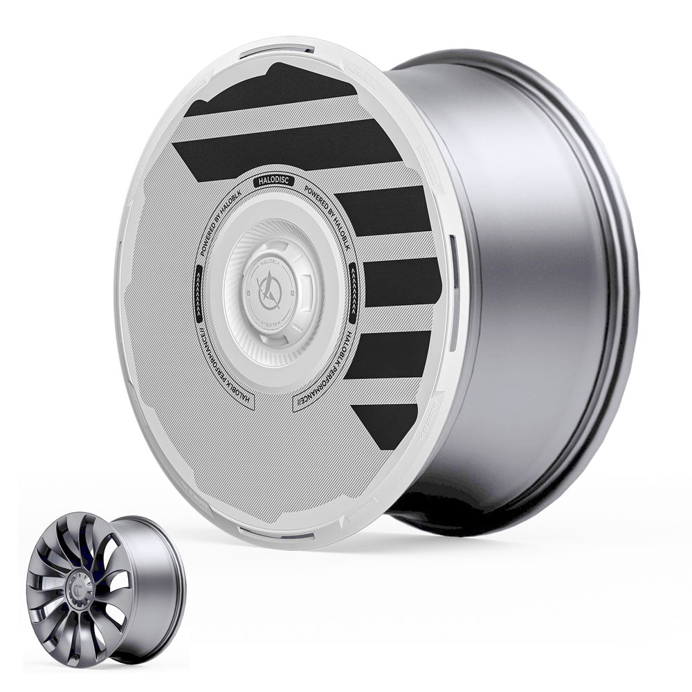 The HALODISC 2 Wheel Covers for Tesla Model Y 21" Überturbine Wheels by HALOBLK Store feature a sleek silver metallic rim and white aerodynamic cover with black diagonal stripes; inset shows the uncovered multi-spoke rim design.
