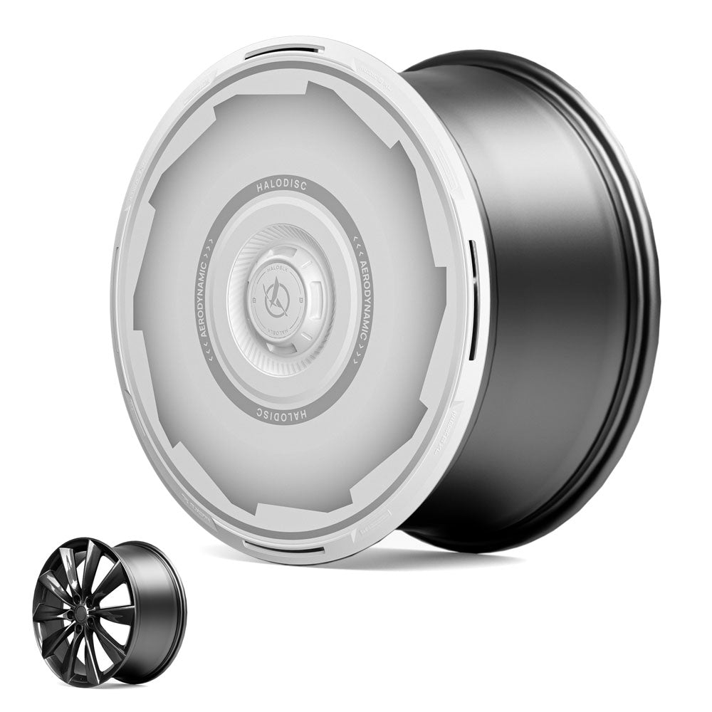 The HALODISC 2 Wheel Covers for Tesla Model S 21" Turbine Wheels by HALOBLK Store feature a sleek silver and black design, shown against a white background with a smaller, traditional black rim in the lower left for comparison.