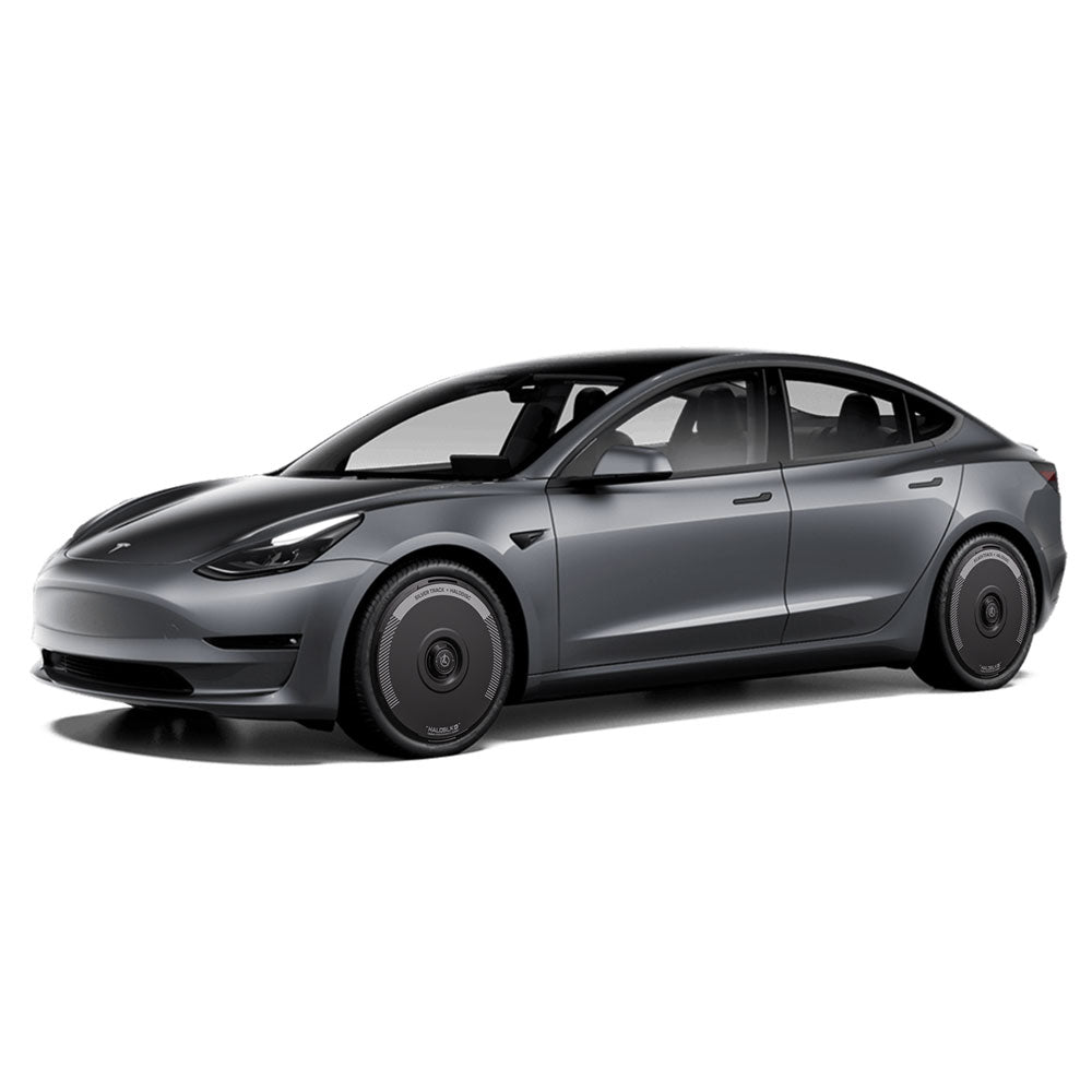 A Tesla Model 3 (2018-2023) with HALODISC 2 Silver Track Wheel Covers for 19" Stiletto Wheels by HALOBLK Store, viewed from the front left on a white background.