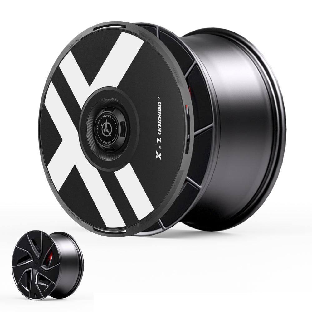 HALODISC 2 Wheel Covers for Tesla Model S 19" Magnetite Wheels by HALOBLK Store feature a modern black design with bold white diagonal stripes, angular details, and a centered hub. A smaller version is displayed in the bottom left corner.