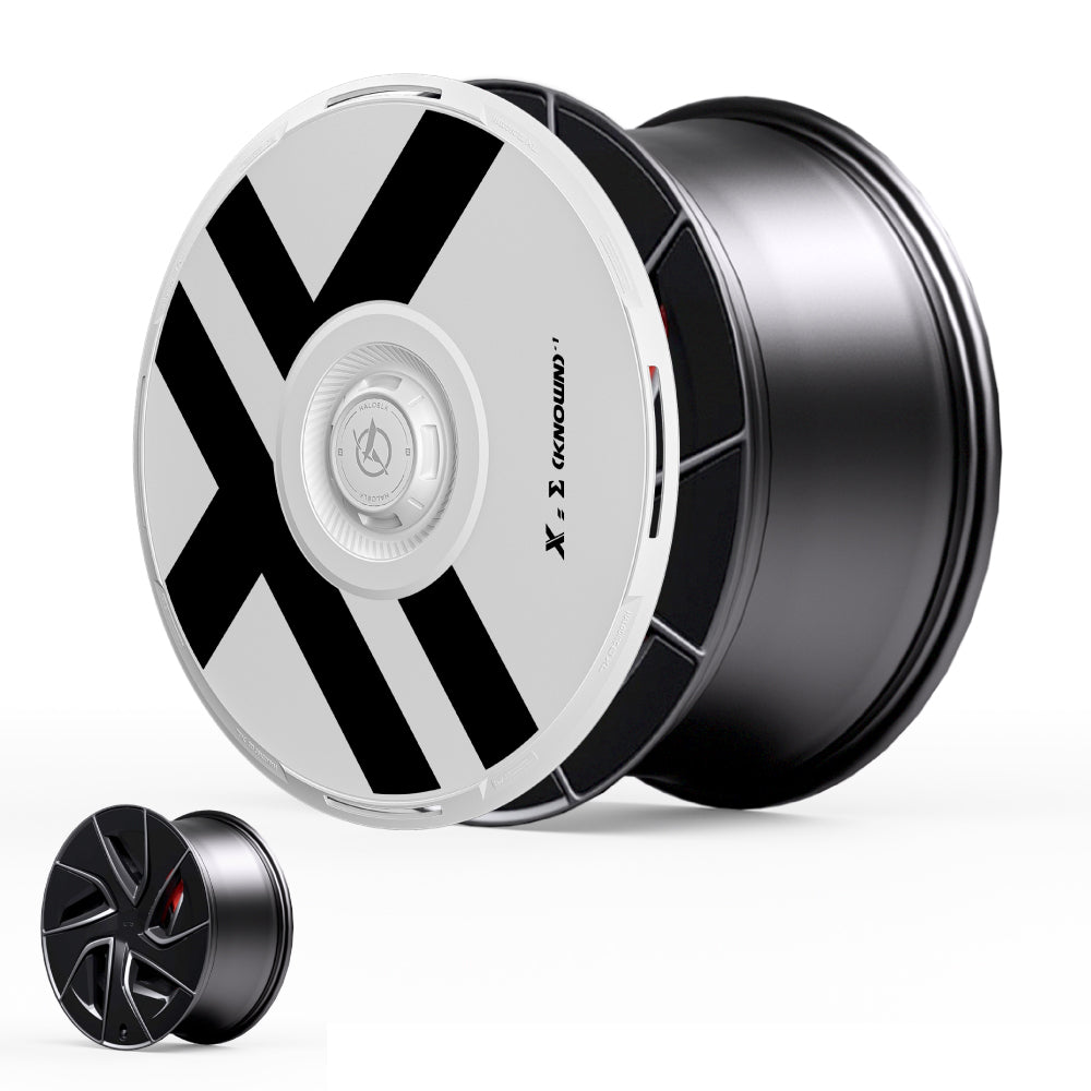 The HALODISC 2 Wheel Covers for Tesla Model S 19" Magnetite Wheels by HALOBLK Store feature a bold black and silver X-shaped design, shown with a matching smaller rim on a white background.
