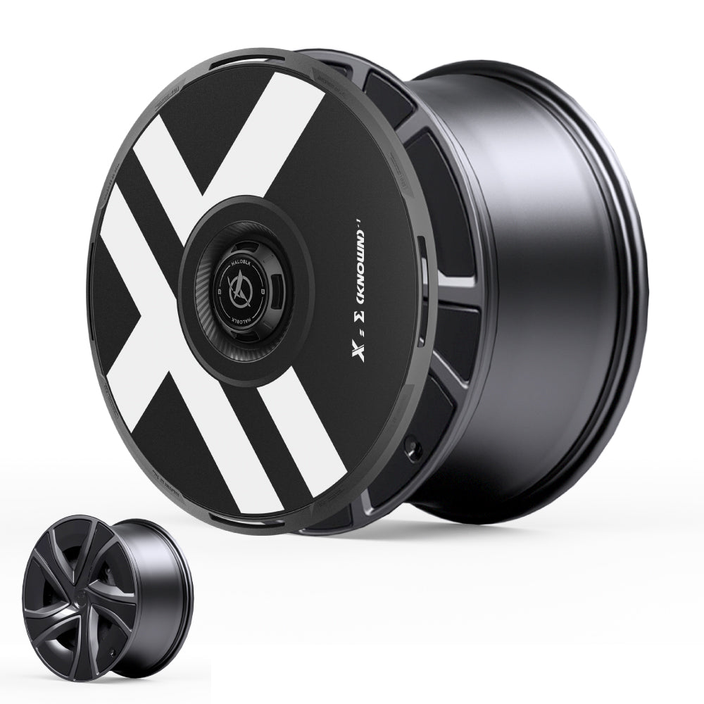 The HALODISC 2 Wheel Covers by HALOBLK Store for Tesla Model X 2021-2025 feature a modern black design with bold white X-shaped stripes and a sleek, glossy finish, shown from both front and side views for the 20" Perihelix Wheels丨X-Factor.