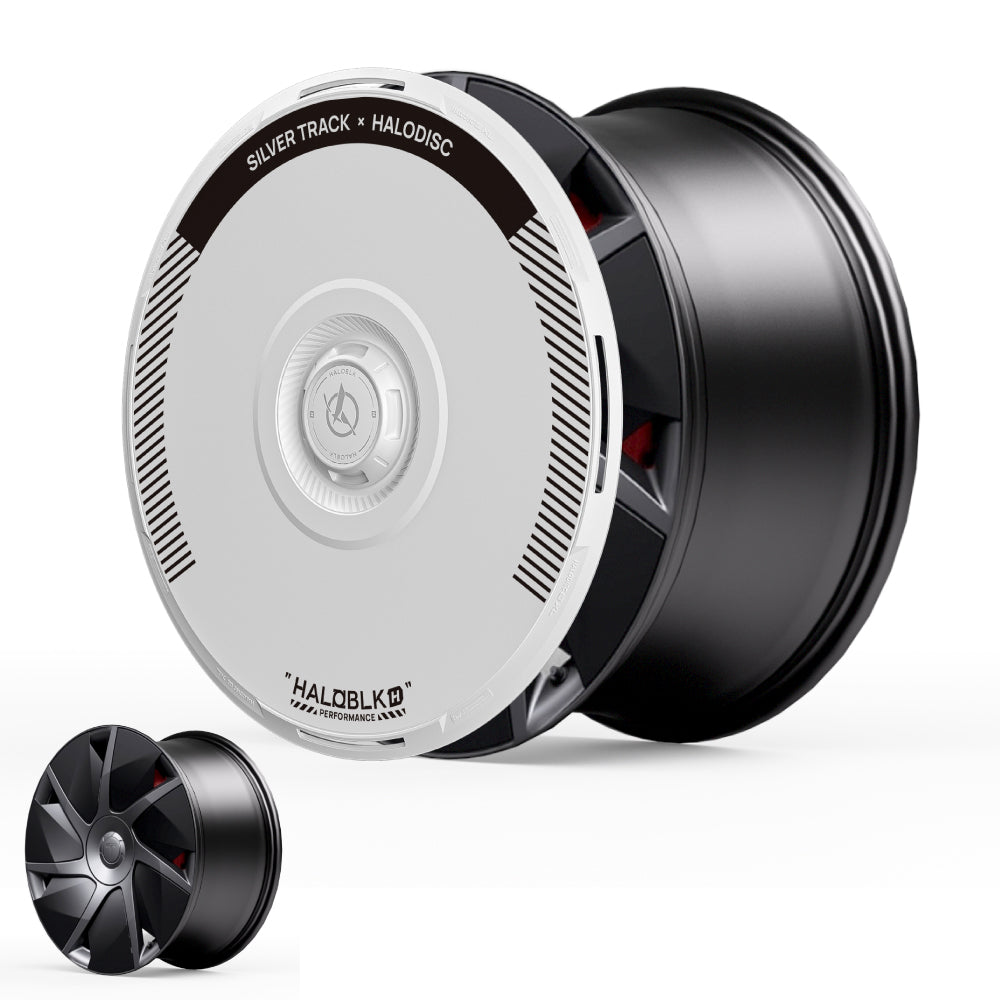 A large black and silver HALODISC 2 Wheel Cover for Tesla Model S 21" Velarium Wheels by HALOBLK Store, labeled Silver Track, stands upright with a smaller matching cover beside it on a white background.