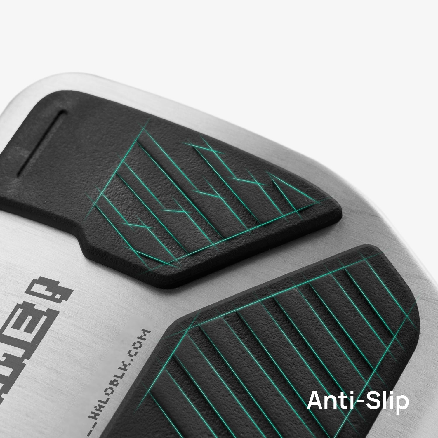 Close-up of Alloy Pedals 2 for Tesla by HALOBLK Store, featuring a metallic surface with black textured anti-slip pads, green accent lines, and "Anti-Slip" text in the lower right corner.