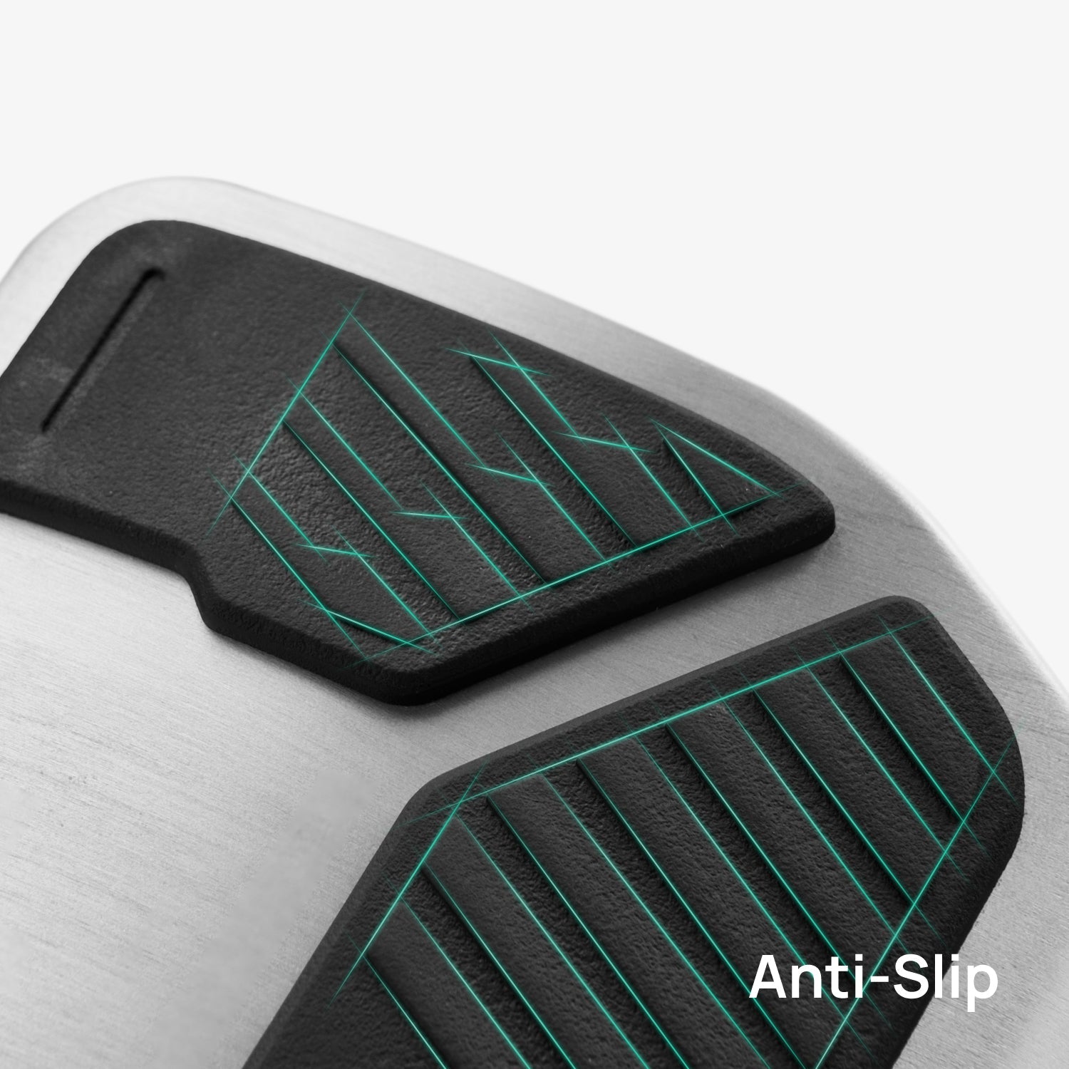 Close-up of Alloy Pedals 2 for Tesla by HALOBLK Store: metallic surface with two black, textured anti-slip pads featuring green lines. "Anti-Slip" in white text appears in the bottom right corner.