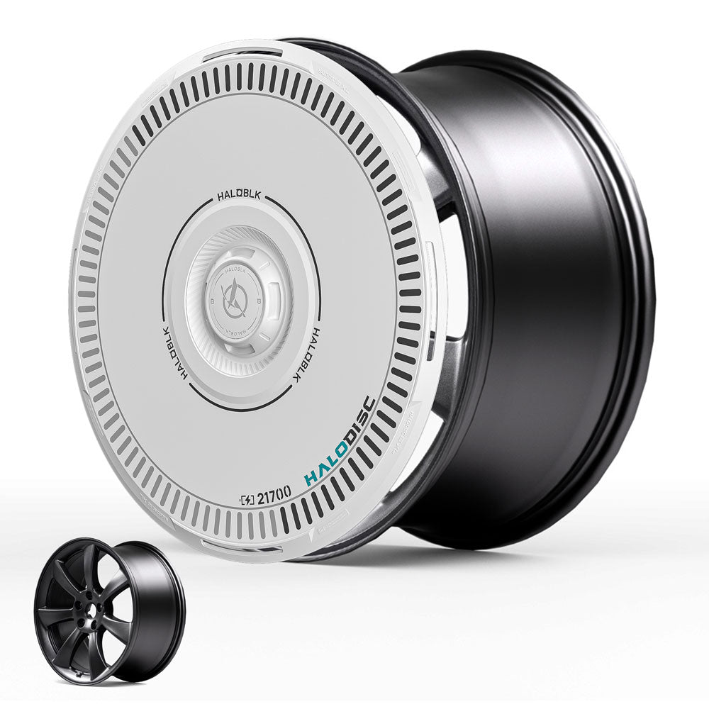 The HALODISC 2 Wheel Covers for Tesla Model 3 2017-2018 19" Performance Wheels by HALOBLK Store feature a sleek, futuristic black and white design with fine detailing; a traditional alloy wheel appears in the bottom left for comparison.