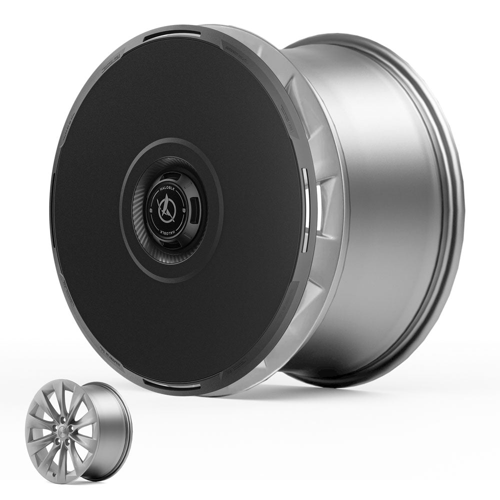 The HALODISC 2 Wheel Covers for Tesla Model X 2016-2020 (20" Slipstream Wheels) by HALOBLK Store are shown with a bold black center and metallic edge, displayed next to a traditional multi-spoke alloy wheel rim for comparison.