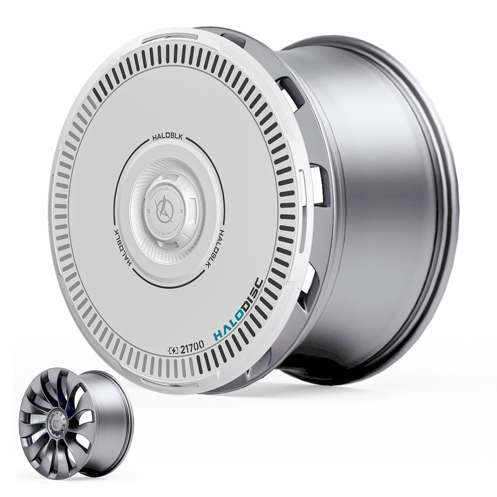 A close-up of HALODISC 2 Wheel Covers for Tesla Model Y 21" Überturbine Wheels by HALOBLK Store, showcasing their silver and white cylindrical design with turbine-like vents and detailed markings; a smaller cover is shown for scale.