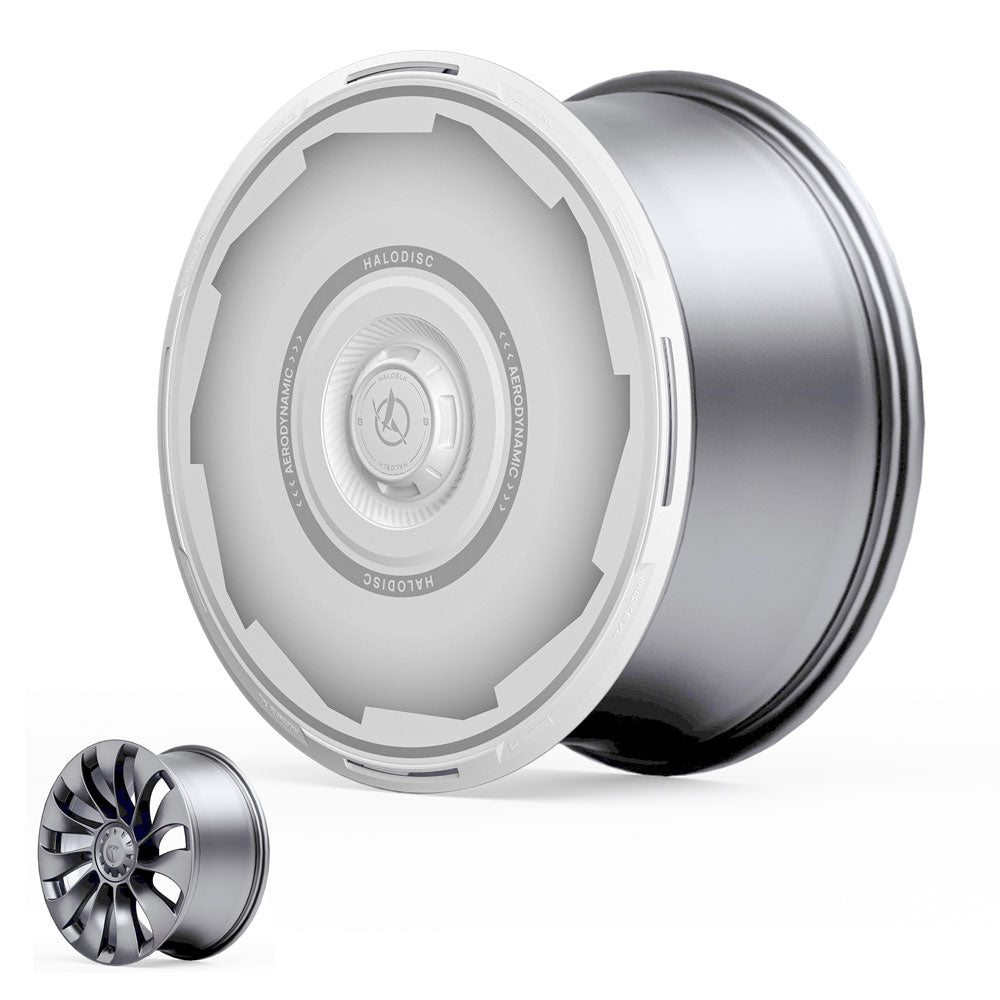The HALODISC 2 Wheel Covers for Tesla Model Y 21" Überturbine Wheels by HALOBLK Store feature a sleek, modern silver rim with a smooth white aerodynamic cover. A smaller, open-spoke rim appears in the lower left for comparison.