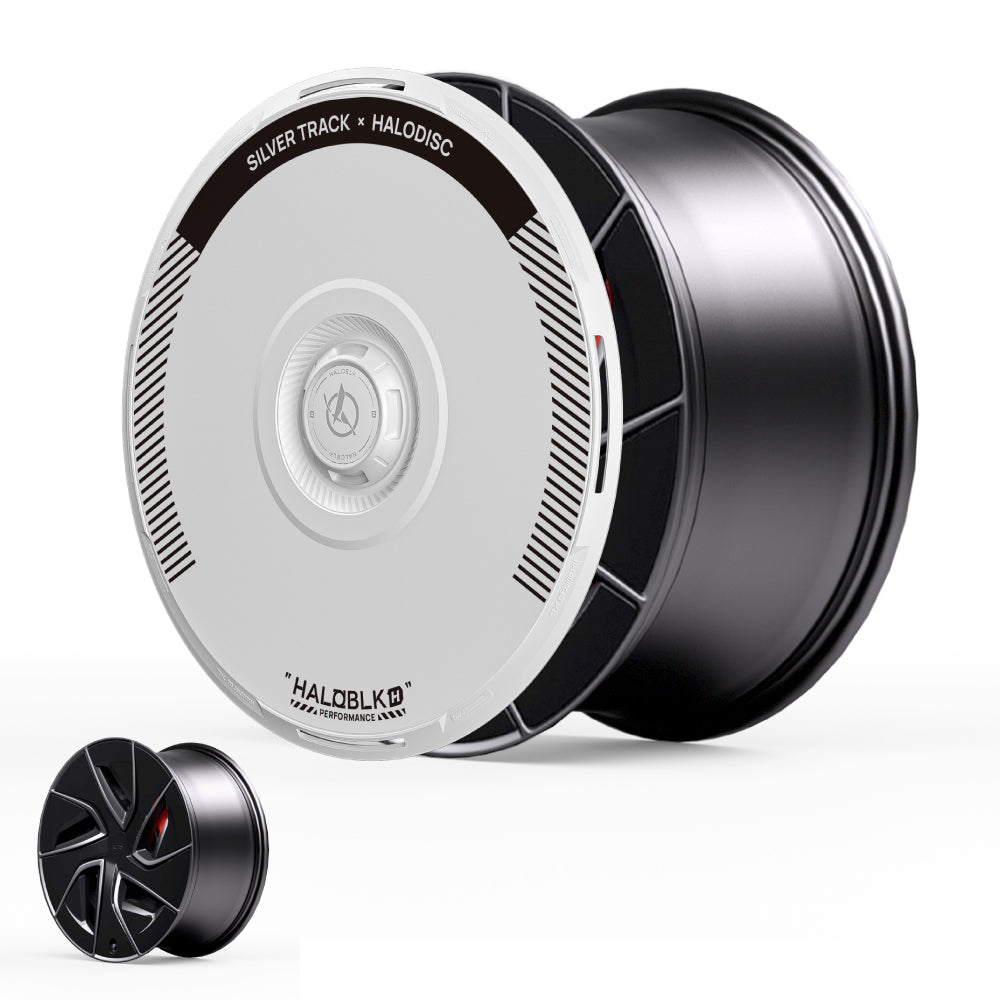 The HALODISC 2 Wheel Cover for Tesla Model S 19" Magnetite Wheels by HALOBLK Store features a large black cover with a white disc labeled "SILVER TRACK x HALODISC," shown next to a smaller black wheel with a geometric design for comparison.