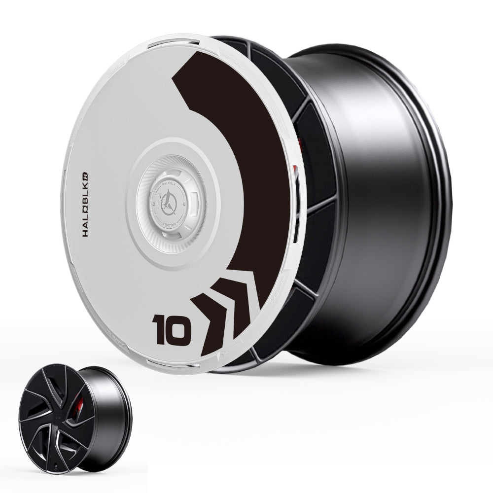 The HALODISC 2 Wheel Covers by HALOBLK Store for Tesla Model S 19" Magnetite Wheels feature a bold, black and white geometric "Arrow" design with the number 10 and a small version shown in the bottom left corner.