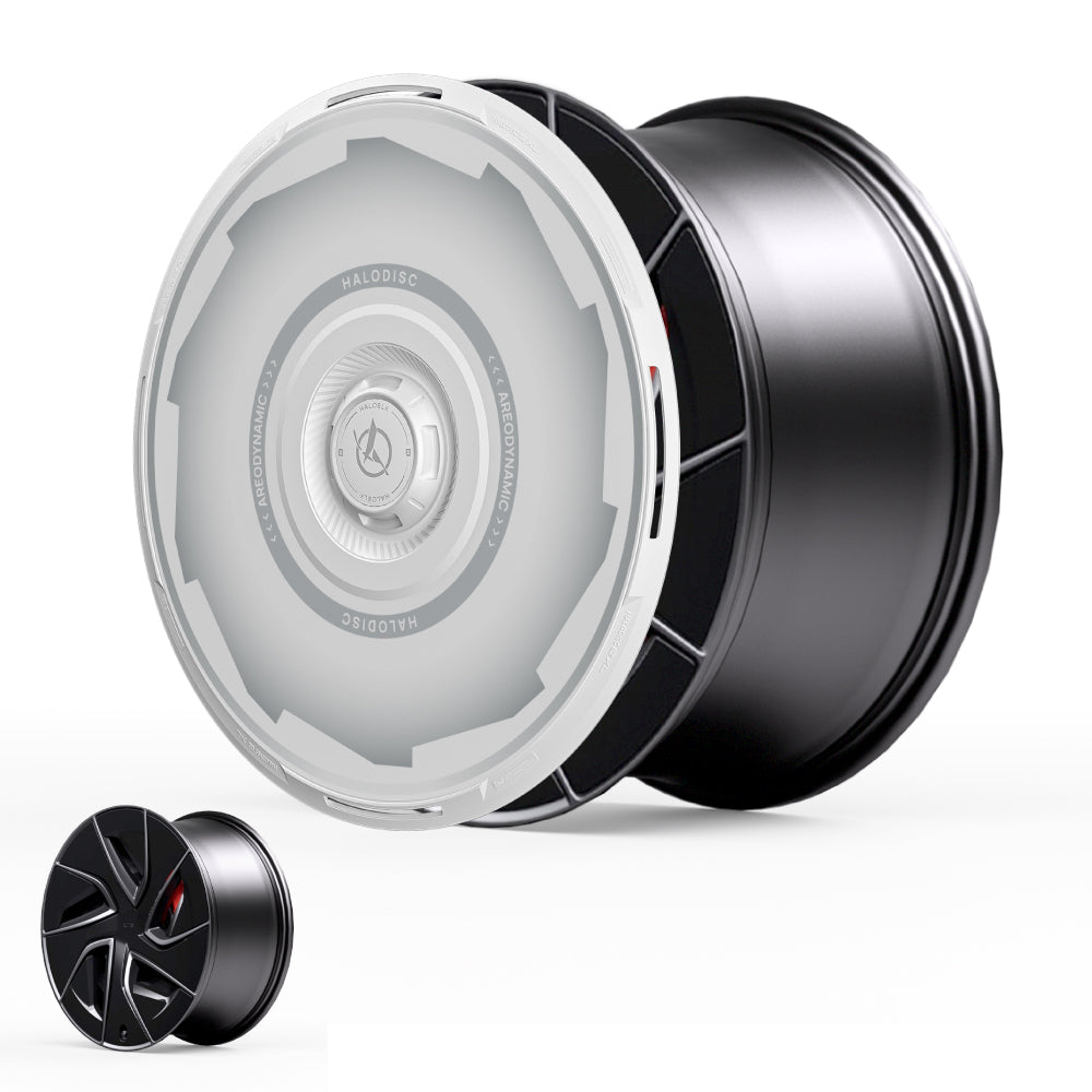 The HALODISC 2 Wheel Covers for Tesla Model S 19" Magnetite Wheels by HALOBLK Store are shown in black and silver with a white translucent disc cover. A smaller version appears in the lower left on a plain white background. Vision-GT design featured.