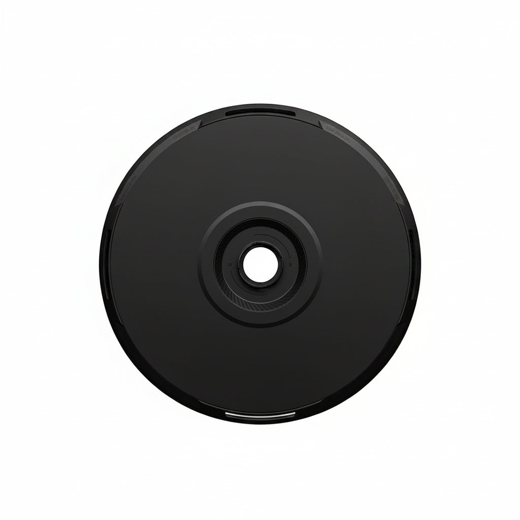 A black HALODISC 2 Replacement Wheel Cover for Tesla Model Y by HALOBLK Store, shown from the side against a white background, features a solid design with a central hub and subtle silver accents around the edge.
