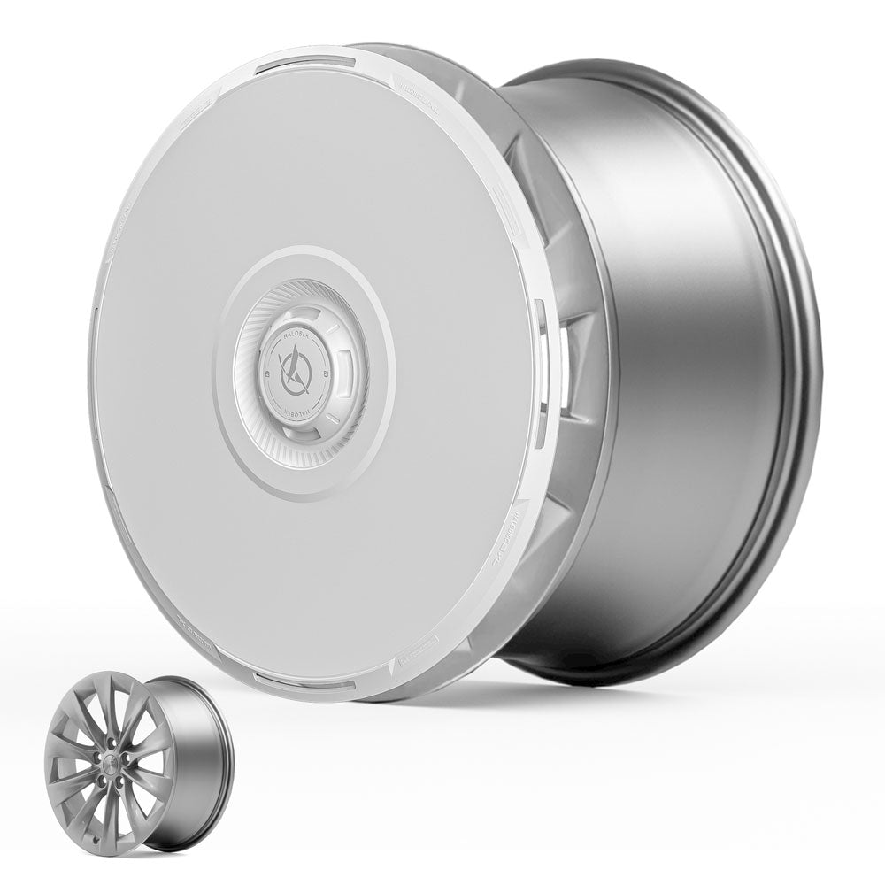 The HALODISC 2 Wheel Covers for Tesla Model S 19" Slipstream Wheels by HALOBLK Store feature a sleek, modern silver design with a smooth face and hubcap, shown alongside a smaller open-spoke rim for comparison.